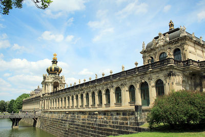 Low angle view of historical building against cloudy sky