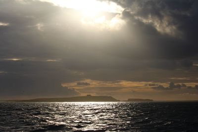 Scenic view of sea against sky during sunrise over the farne islands