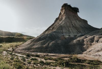 Panoramic view of land and mountains against sky