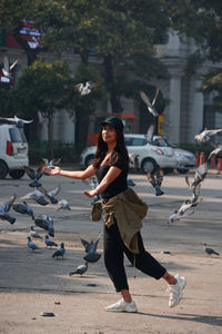 Full length of woman on street in city
