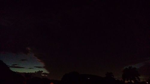 Scenic view of landscape against sky at night