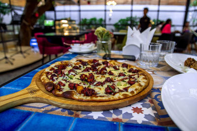 Close-up of pizza served on table