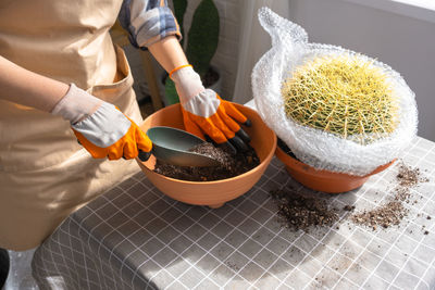 Midsection of man preparing food