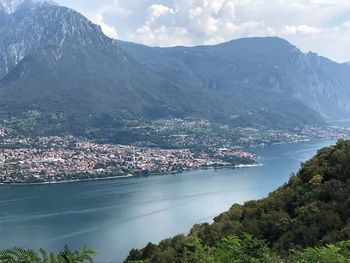 Scenic view of sea and mountains against sky