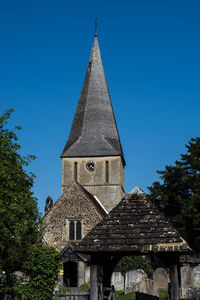 Low angle view of building against clear blue sky