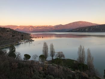 Scenic view of lake against sky during sunset