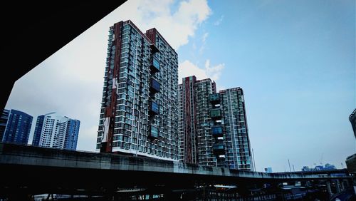 Low angle view of modern buildings against sky