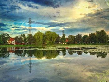 Scenic view of lake against cloudy sky