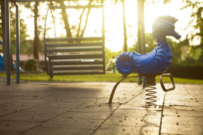 Spring seahorse play equipment in park during sunset