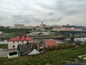 Built structures against cloudy sky