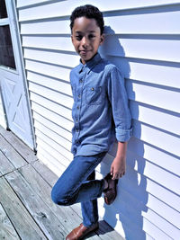 Portrait of boy standing outdoors