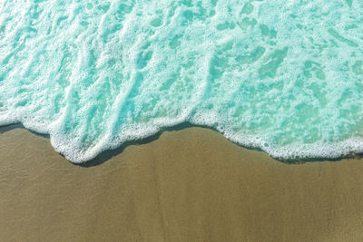 High angle view of sand on beach