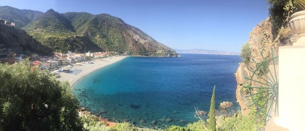 Scenic view of sea against clear blue sky