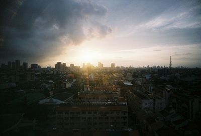 Cityscape against sky during sunset