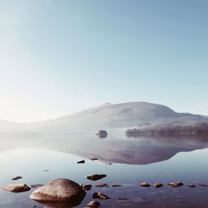 Scenic view of lake with mountains in background