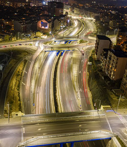 High angle view of light trails on road at night