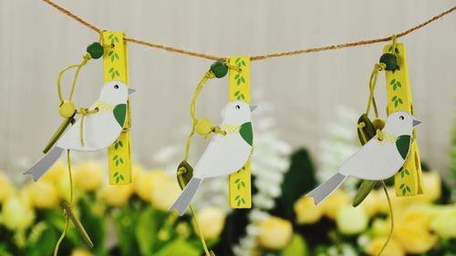 Close-up of clothespins hanging on fence