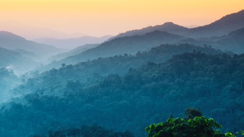 Scenic view of mountains against sky during sunset