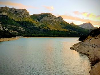 Scenic view of lake against sky during sunset