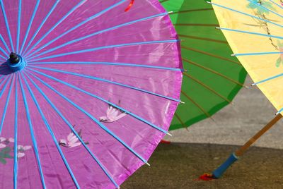 Colorful umbrellas on footpath