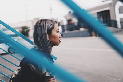 Portrait of young woman looking away