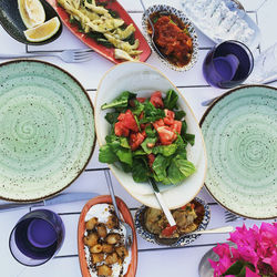 Mediterranean cuisine. appetizers and salad in seaside restaurant. colourful meze on ceramic plates