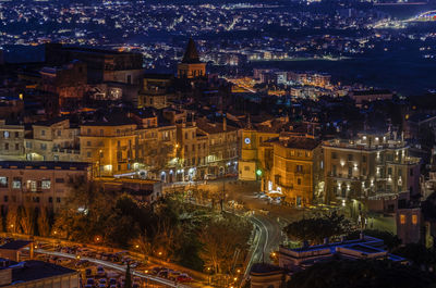 High angle view of illuminated buildings at night