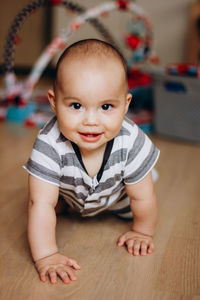 Portrait of cute baby boy at home