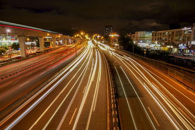 High angle view of light trails on road at night