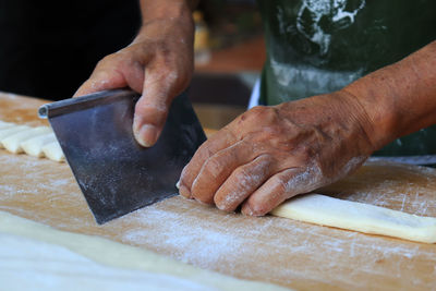 Midsection of man preparing food