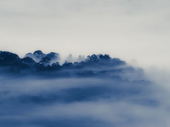 Scenic view of fog against sky