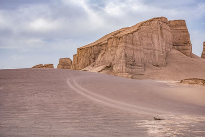 Rock formations in desert against sky