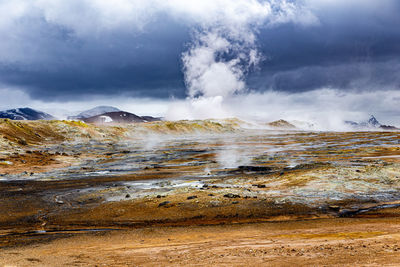 Scenic view of clouds over mountain against sky