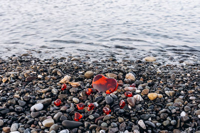 Close-up of heart shape with pebbles