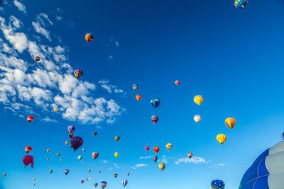 Low angle view of hot air balloons in sky