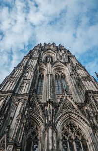 Low angle view of cathedral against cloudy sky