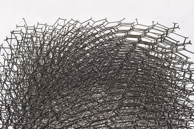 Low angle view of the hive at park against clear sky