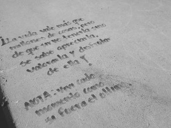 High angle view of footprints on sand at beach