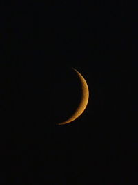 Low angle view of moon in sky at night