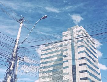 Low angle view of modern buildings against sky