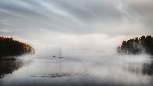 Scenic view of sea against cloudy sky