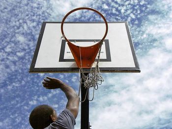 Low angle view of basketball hoop against sky