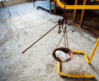 High angle view of rope tied on wood