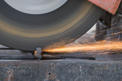 Rebar is being cut with a tool for cutting steel.