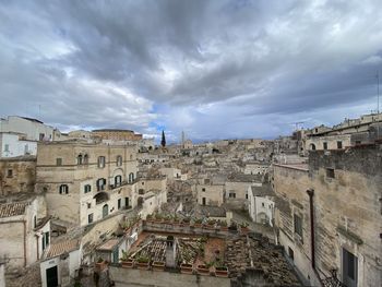 Buildings in city against sky