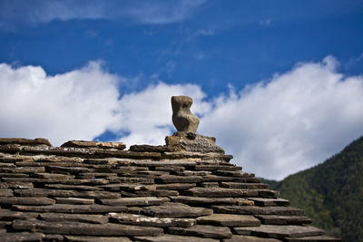 Low angle view of historical building against cloudy sky