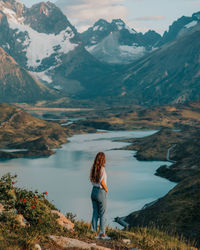 Woman standing against the lake 