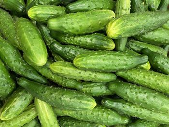 Full frame shot of green chili peppers at market