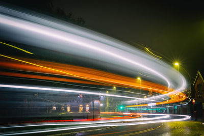 High angle view of light trails on road at night