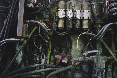 Close-up of rusty machine part in factory
